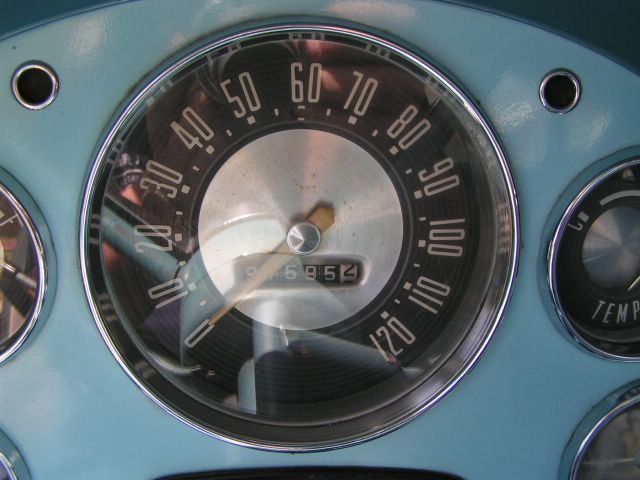 Dashboard gauges with a speedometer up to 120 mph and odometer showing 5954
