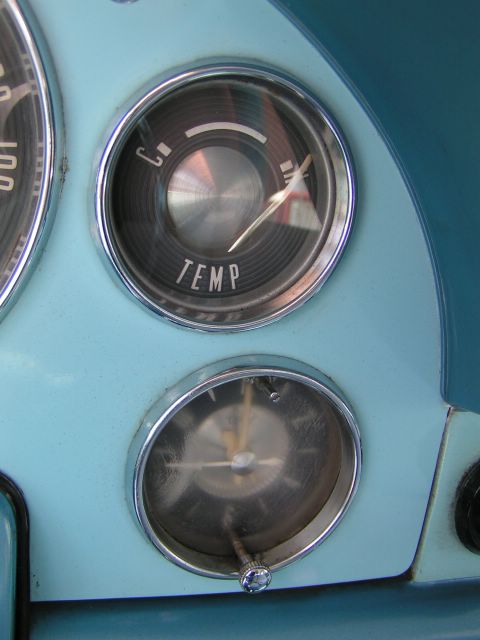 1956 Ford Fairlane - Interior view of a 1956 Ford Fairlane dashboard, highlighting the temperature gauge and clock.