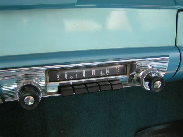 close-up of vintage car radio with push buttons and tuning dial