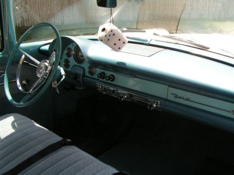 1956 Ford Fairlane - Interior view of a 1956 Ford Fairlane, complete with fuzzy dice.