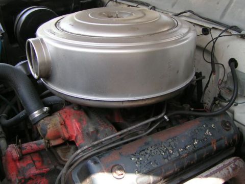 1956 Ford Fairlane - The engine compartment shows a large, round air cleaner over the carburetor.