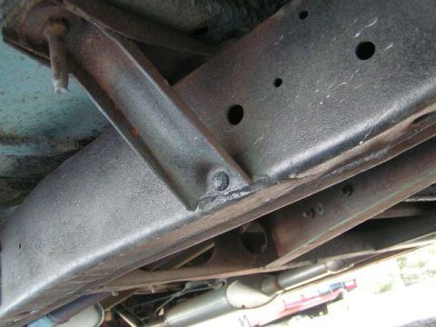 1956 Ford Fairlane - Underbody view showing frame structure and exhaust system components.