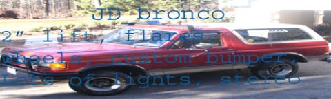 1989 Ford Bronco - This red 1989 Ford Bronco features a 2-inch lift, fender flares, custom bumper, and numerous lights.