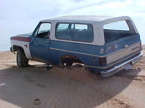 1975 Chevrolet Blazer - no front driveshaft = buried in sand. Kermit TX.
