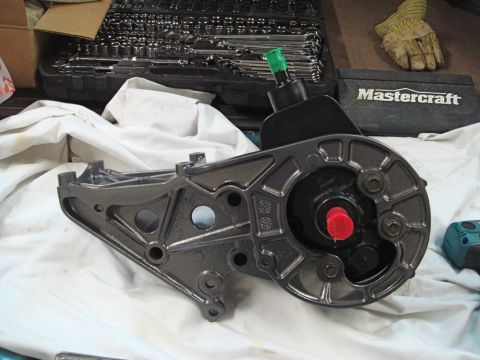 1996 Ford Bronco - A power steering pump sits on a white cloth, with tools and a glove in the background.