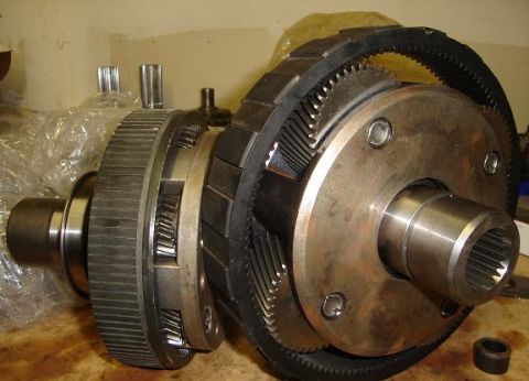 2000 Chevrolet Tahoe - Close-up of a differential assembly, showing intricate gears and a band, likely a vehicle component.