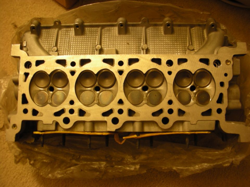 Underside of an aluminum SOHC V engine cylinder head