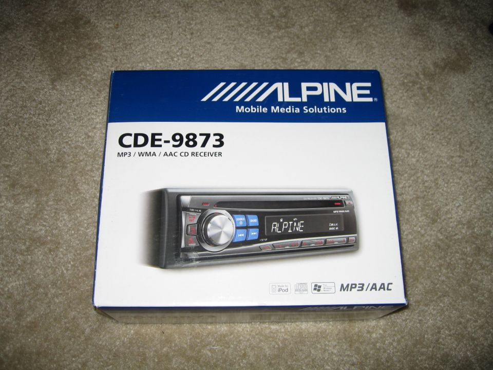 Alpine CDE-9873 car stereo box with a picture of the stereo