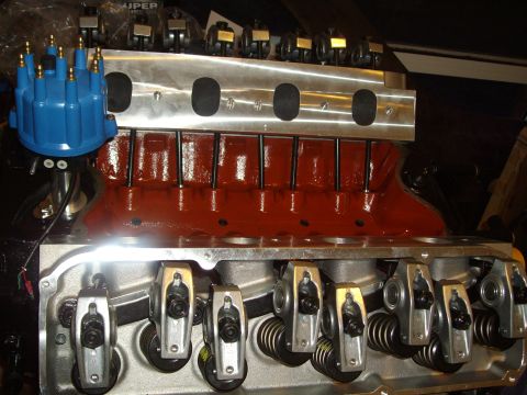 1985 Ford Bronco - Close-up view of an engine's internal components, including the intake manifold, cylinder heads, and distributor.