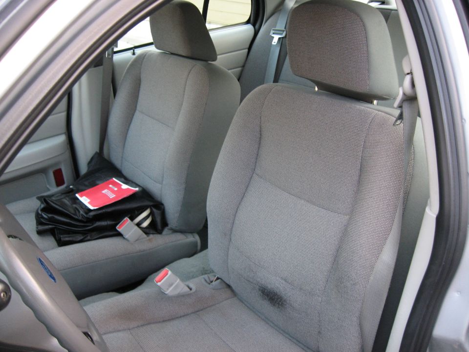 Interior view of a 2004 Ford Crown Victoria showing front seats and dashboard