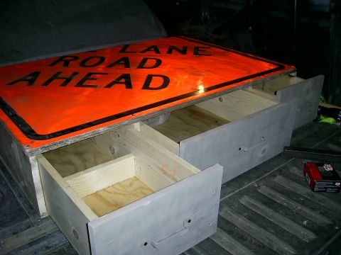1978 Ford Bronco - Custom storage unit built into a vehicle bed, drawers and a repurposed road sign as a lid.
