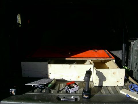 1978 Ford Bronco - Custom wooden storage drawers are being built or installed in the bed of a pickup truck.