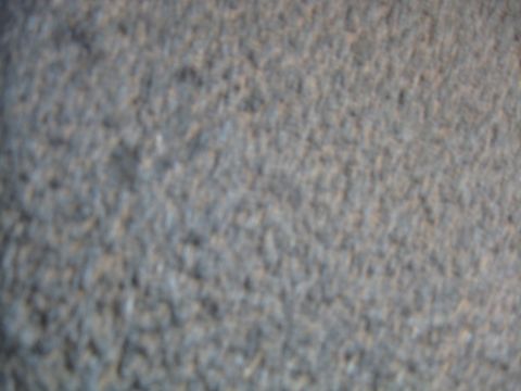 1990 Ford Bronco - The image shows a close-up of a textured gray carpet.