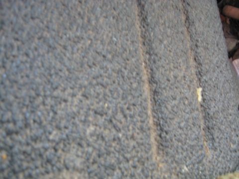 1990 Ford Bronco - A close-up view of a textured surface, possibly a vehicle part, with a visible seam and a watermark.