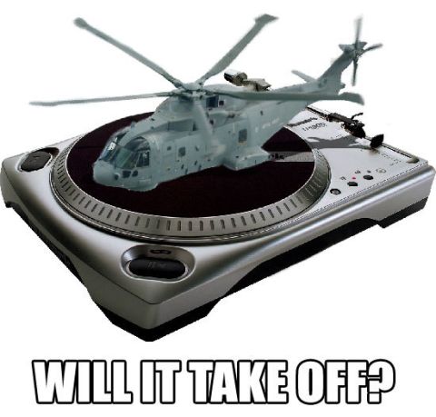 1991 Ford Probe - A model helicopter is placed on a turntable, prompting the question 'WILL IT TAKE OFF?'.