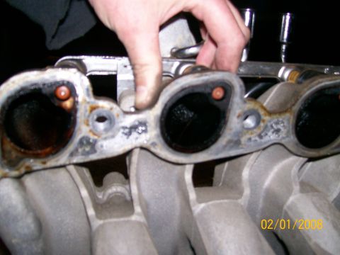 1995 Mercury Grand Marquis - Close-up of an intake manifold gasket, likely removed for repair or inspection.