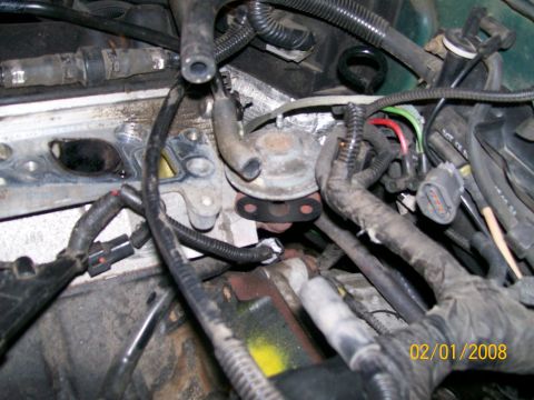 1995 Mercury Grand Marquis - Close-up view of engine components, including intake manifold and various hoses.