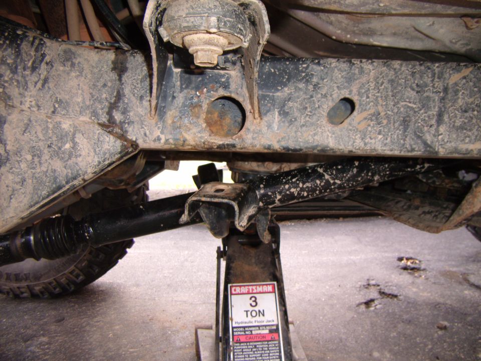 Underbody of vehicle supported by a 3-ton hydraulic jack