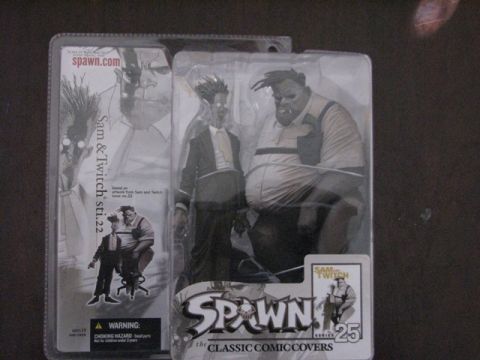 1991 Ford Bronco - Two Spawn toy figures are displayed in their original packaging, artwork from the comic series.