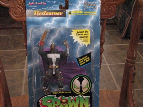 1991 Ford Bronco - This is a Spawn Redeemer action figure in its original packaging, a light-up chest and sword.