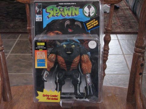 1991 Ford Bronco - Action figure packaged for sale, with "Spring-Loaded Fist Action" noted.