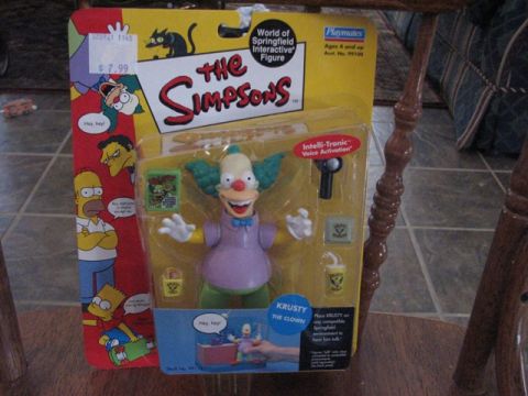 1991 Ford Bronco - Krusty the Clown action figure from The Simpsons, packaged with accessories and interactive voice activation feature.
