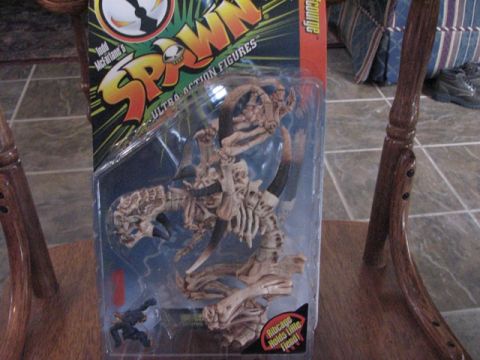 1991 Ford Bronco - This is a Spawn action figure in its original packaging, a skeletal monster.