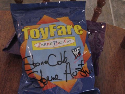 1991 Ford Bronco - A ToyFare bag the WWF logo and autographs from Stone Cold Steve Austin is displayed.