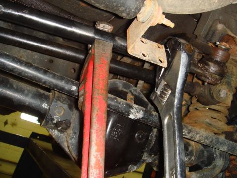 1996 Ford Bronco - Close-up view of vehicle's steering and suspension components being worked on.