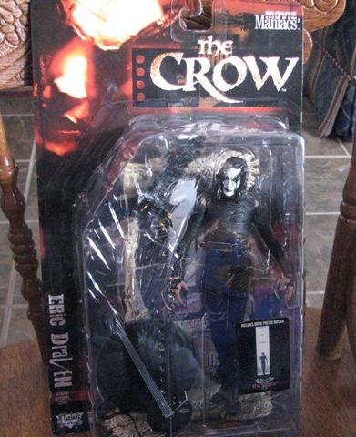 1991 Ford Bronco - The Crow action figure, part of the Movie Maniacs series, is displayed in its original packaging.
