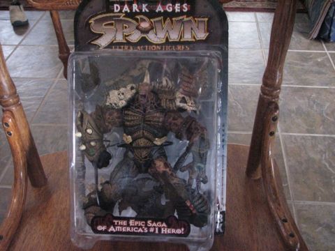 1991 Ford Bronco - This is a Spawn action figure in its original packaging, the "Dark Ages" and "Spawn" branding.