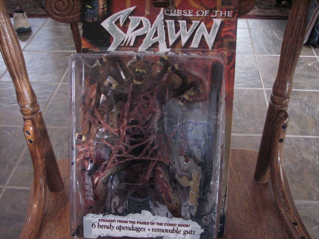 Spawn action figure toy in packaging, labeled 'Curse of the Spawn'