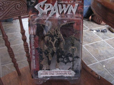 1991 Ford Bronco - A collectible Spawn action figure is displayed in its original packaging, detailed artwork and text.