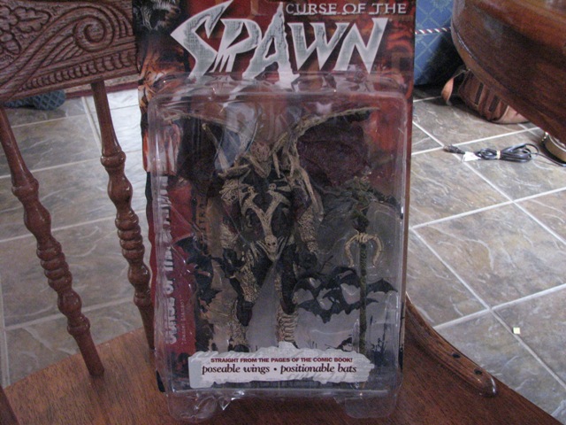 Spawn action figure in packaging, says 'Curse of the Spawn' and 'poseable wings, positionable bats'
