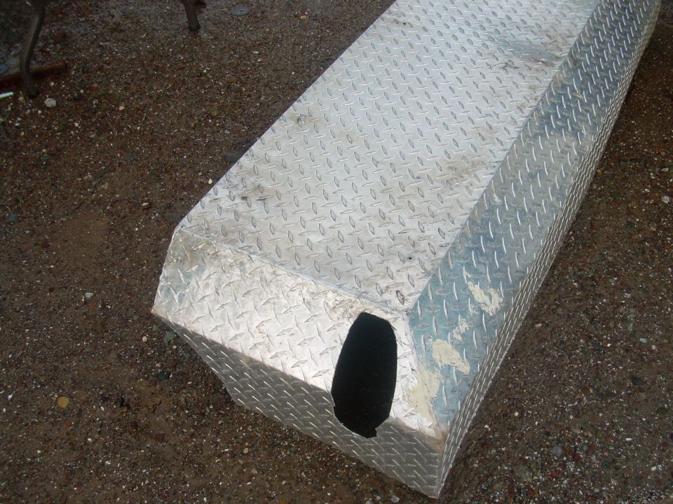Diamond plate toolbox with a cutout on the side