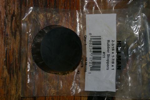 1986 Ford Bronco - Packaged rubber stoppers with dimensions and part number visible on the label.