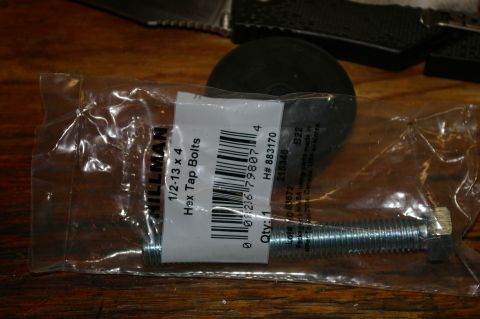 1986 Ford Bronco - Packaging for Hillman hex tap bolts, size 1/2-13 x 4, is shown on a wooden surface.