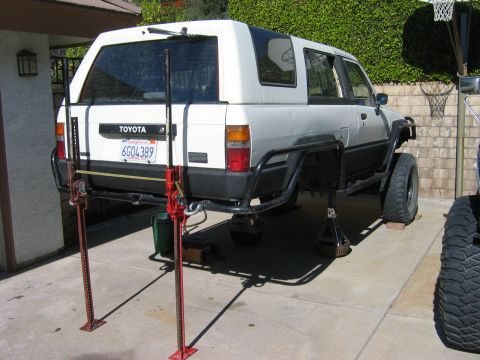1985 Toyota 4Runner - 1985 Toyota 4Runner being worked on, rear axle elevated with two Hi-Lift jacks.