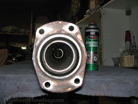 1968 Ford Mustang - Exhaust pipe flange shown up close, with a can of brake cleaner to its right.