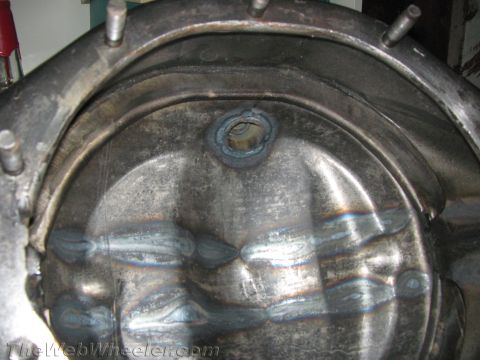 1968 Ford Mustang - Close-up view of a welded differential housing, showing internal metalwork and a circular opening.