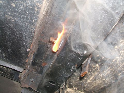 1969 Ford Torino - Welding a bolt on a rusty frame, with visible flame and smoke.