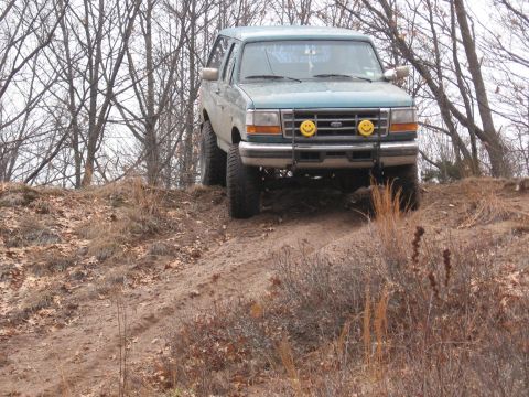 1996 Ford Bronco - This 1996 Ford Bronco is seen off-road, equipped with distinctive smiley face headlights.