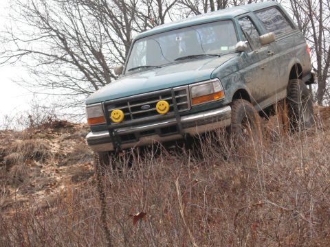 1996 Ford Bronco - This 1996 Ford Bronco is shown navigating a steep, dry, grassy incline.