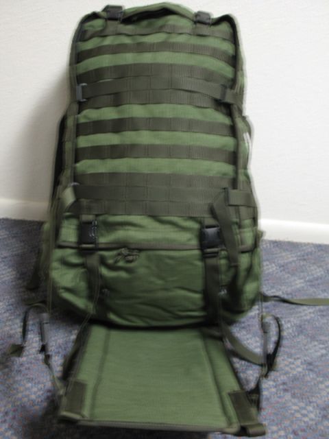 1991 Ford Bronco - A green tactical backpack is shown standing upright against a wall.