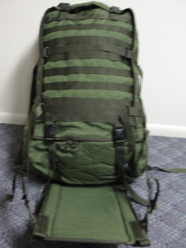 Green tactical backpack with MOLLE webbing and adjustable straps
