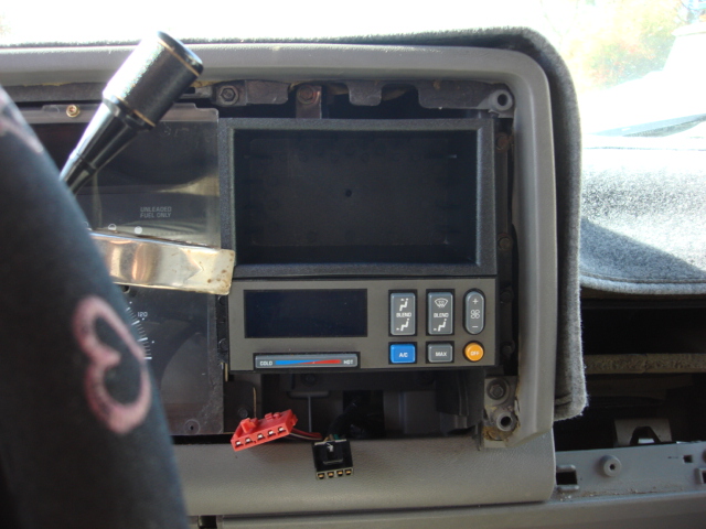 i could not find a grey storage cubbie so i opted for black. it is held in place with 4 screws (same ones that held the radio controller in place.