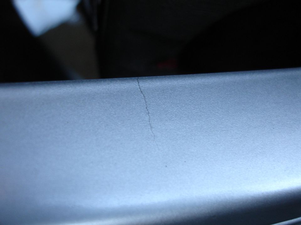 Close-up of a crack on silver interior trim