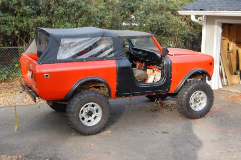 1994 Ford Bronco - This off-road vehicle is undergoing some work, with its doors off and interior exposed.