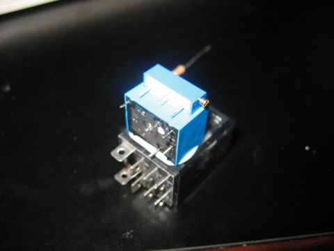 1995 Ford C-350 (Centurion Conversions) - Close-up view of an electrical relay with a blue housing and metal pins.
