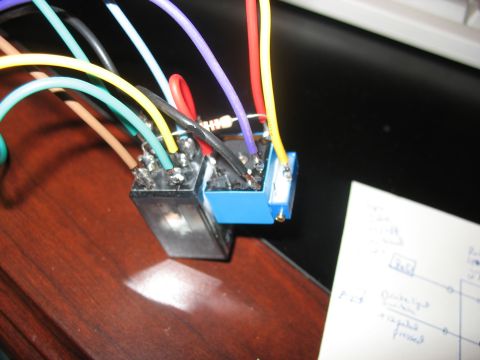 1995 Ford C-350 (Centurion Conversions) - Close-up of electrical relays and wiring, with a diagram visible in the background.